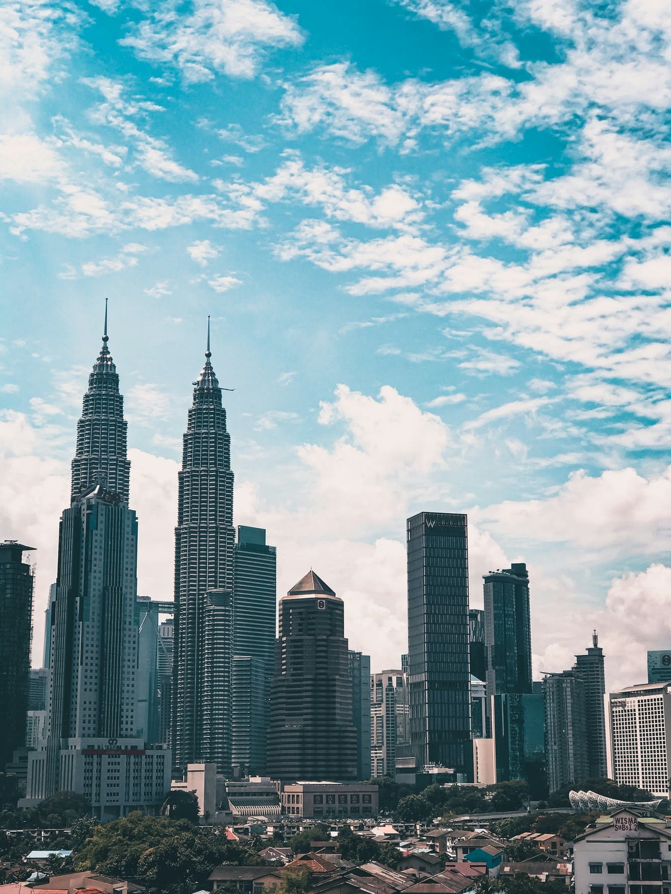 Petronas Twin Towers and the Kuala Lumpur skyline on a clear day